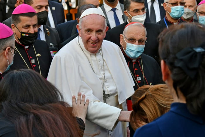 Pope Francis visits Iraqi Christians who suffered under IS
