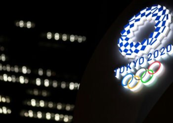 Japan PM warns of closed-door Olympics as virus cases rise