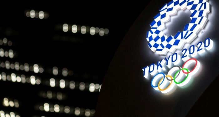 Japan PM warns of closed-door Olympics as virus cases rise