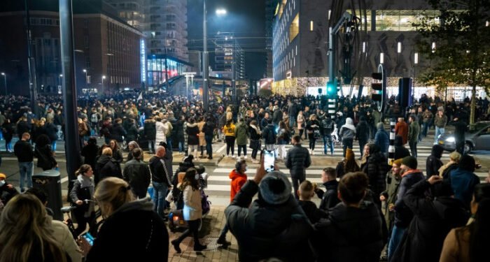 Dutch police fire warning shots as Covid riots hit Rotterdam
